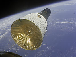 This view of the Earth-orbiting Gemini VII spacecraft was taken from the Gemini VI spacecraft during their historic rendezvous mission in space.