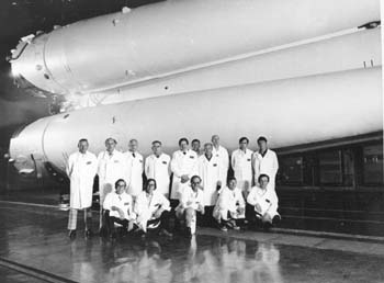 ASTP Working Group 4 in front of Soyuz Launch Vehicle - Baikonur, May 1975. (Russian photograph)