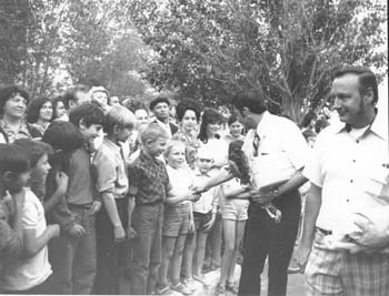Gary Johnson greeting Russians that turned out to see the first Americans at Lennisk, a town near Bailonur, May 1975.