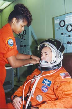 STS-44 Commander Fred Gregory being suited and tested by McDougle at KSC