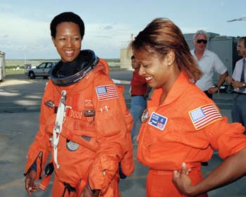 STS-47 flight crew egress training during Terminal Countdown Demonstration Test (TCDT). Mae Jemison and McDougle walking away from the orbiter at the end of the crew training.