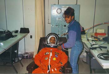 McDougle performing manned suit teating of Mae Jemison at KSC