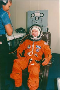 McDougle performing manned suit testing on STS-78 Commander Tom Henricks at KSC