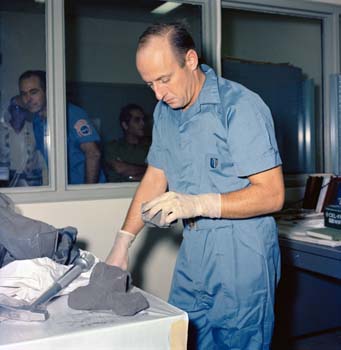 Astronaut Pete Conrad with lunar rocks brought back from the Moon during the Apollo 12 mission.