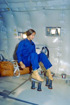 Astronaut Marsha Ivins on the KC-135 performing a Zero G evaluation of intravehicular activity (IVA) boots.