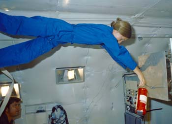 Astronaut Marsha Ivins on the KC-135 performing a Zero G evaluation of orbiter fire extinguishers.