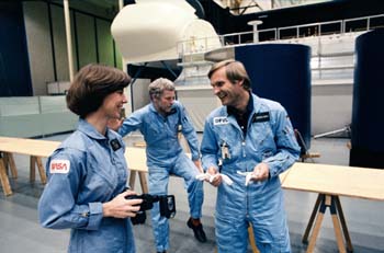 STS 61-A crew members Bonnie Dunbar, Reinhard Furrer, and Ernst Messerschmid training in Building 9A before their mission.