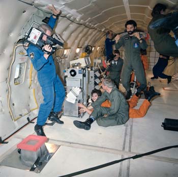 Zero-Gravity training on KC-135.  Terry Slezak is (on the left with camera) is capturing the activity on film.