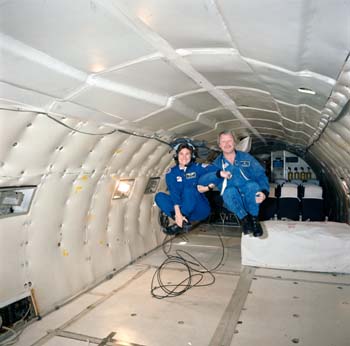 View of Stephanie Wells and photographer Terry Slezak free floating in KC-135 during a Zero G flight.