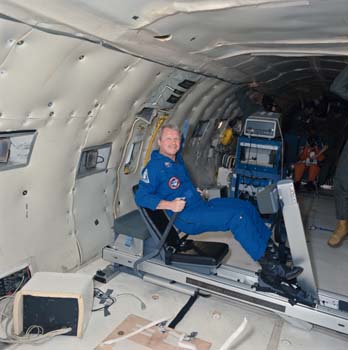 Terry Slezak on a Triad Rowing device during Zero-Gravity testing in the KC-135 aircraft. 