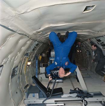 Terry Slezak on a Triad Rowing device during Zero-Gravity testing in the KC-135 aircraft. 