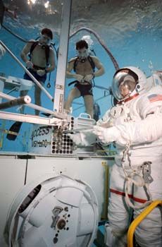 Underwater documentation using the AX-5 and MK III 8.3 PSI suits and the Space Shuttle 4 PSI suit in WETF evaluation runs, May 1989.