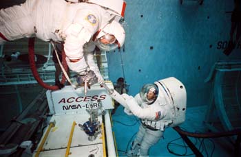 Underwater documentation using the AX-5 and MK III 8.3 PSI suits and the Space Shuttle 4 PSI suit in WETF evaluation runs, May 1989.