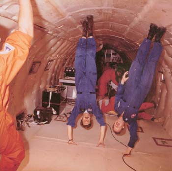 Astronaut Dale Gardner and Terry Slezak during a Zero G flight on the KC-135 aircraft.