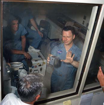 Terry Slezak in the Lunar Receiving Lab showing Moon dust on his hand from the Apollo 11 film canisters