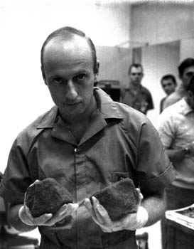 Astronaut Pete Conrad, commander of the Apollo 12 mission, holds two lunar rocks brought back from the Moon by the Apollo 12 astronauts. 