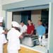 Food line personnel serving Apollo 11 crew and support personnel in the Lunar Receiving Lab Crew Reception Area.