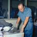 Astronaut Pete Conrad with lunar rocks brought back from the Moon during the Apollo 12 mission.