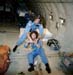 STS 51-L “Teacher in Space” Christa McAuliffe and her backup crew member, Barbara Morgan (in back), training on the KC-135 Zero G aircraft.  Terry Slezak is seated behind.