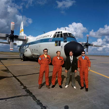 Jim Lindemann, Will Fenner, Frank Newman, Gordon Hrabal pictured in front of the NASA C-130 Earth Resources Aircraft.