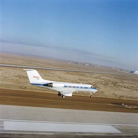 View of the NASA 946 Shuttle Trainer Aircraft coming in for a landing at Ellington Field. 