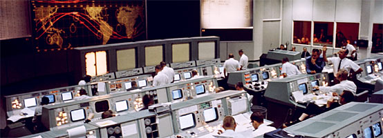 The Mission Control Center during the first day of the Gemini V flight.