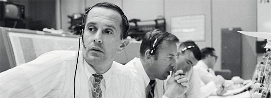 Spacecraft communicators are pictured as they keep in contact with the Apollo 11 astronauts.