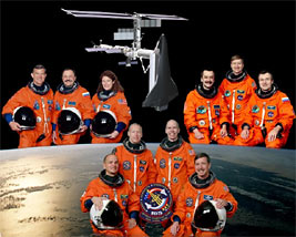 This is the portrait for the astronaut and cosmonaut crew members comprising STS-105 (bottom center) and the Expedition Two (upper left) crew who were replaced by Expedition Three (upper right).