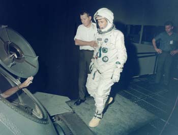 S66-50937.jpg - Mike Fox being assisted by Dean Sprague into the Centrifuge (1966) 