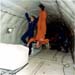 S88-40393.jpg - Mike Fox being held by Stephanie Wells in KC-135 during Micro-gravity training (1988) 