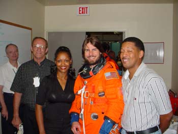 Tom Cruise visited NASA to ride in the Bldg 5 Motion Base. Pictured l to r: Charlie Precourt, Bill Todd, McDougle, Tom Cruise, George Brittingham. 