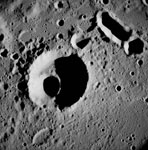 AS08-12-2052 (21-27 Dec. 1968) --- This near-vertical photograph from the Apollo 8 spacecraft covers an area of approximately 50 x 50 statute miles within a 250-statute-miles-in-diameter crater on the lunar farside. The center of this large crater is located at about 157 degrees west longitude and 4 degrees south latitude. The large crater in the center of the picture is about 20 statute miles in diameter.