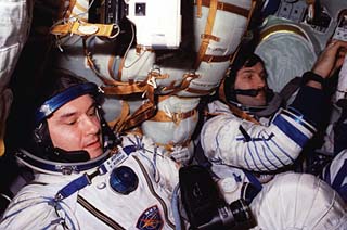 Korzun and Kaleri suited in Soyuz