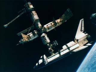 Space Shuttle Atlantis connected to Russia's Mir Space Station - photographed by the Mir-19 crew on July 4, 1995.