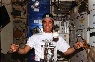 Mission specialist John Blaha floats a baseball in the middeck.