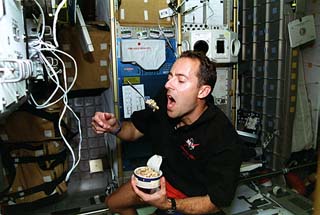 Clervoy eating in the Spacehab.