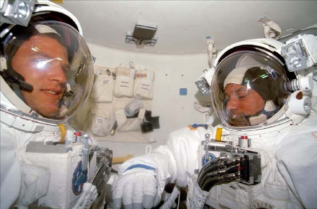 Parazynski and Titov in their extravehicular mobility units