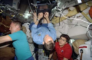 Edwards checking his email on a Spacehab Payload and General Support Computer