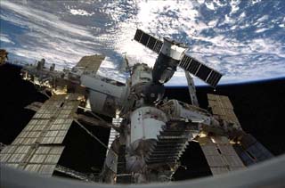 The Mir Space Station mated to the Orbiter Endeavour, as seen from an Endeavour window during STS-89. 