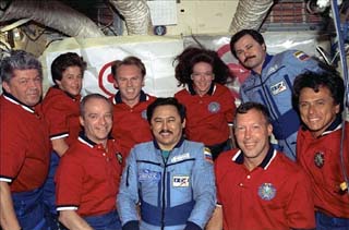 Crewmembers pose for photos in the Mir Base Block